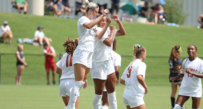 Haley Hopkins celebrates after scoring a goal for the Virginia women's soccer team.